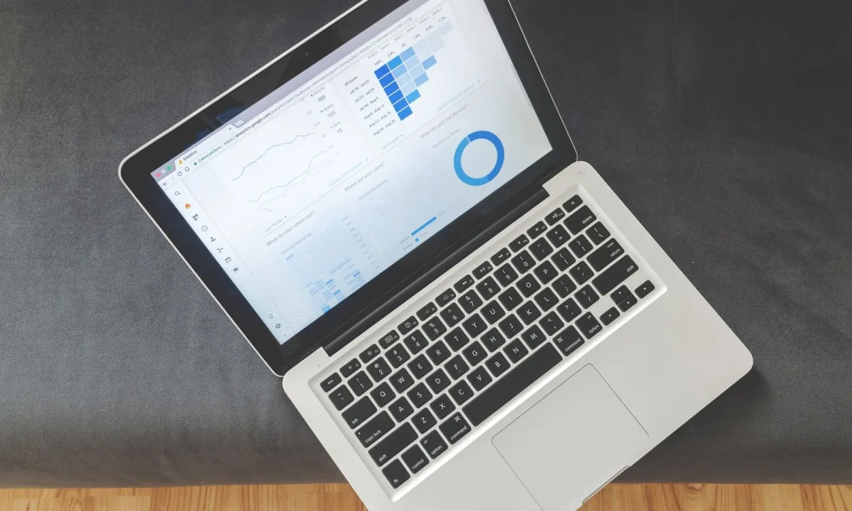 Overhead view of a laptop displaying colorful charts, a common sight when using traffic analysis tools