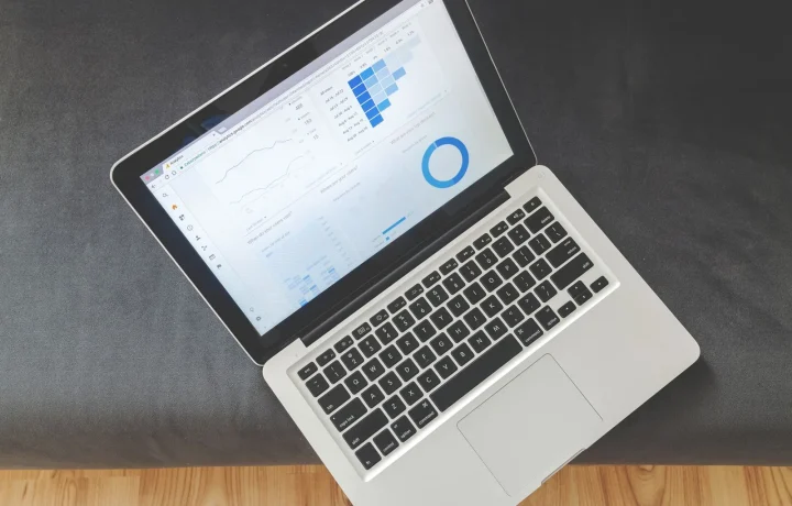 Overhead view of a laptop displaying colorful charts, a common sight when using traffic analysis tools