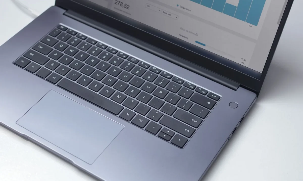 Overhead view of a laptop showing an analytics program, representing the core blog SEO basics