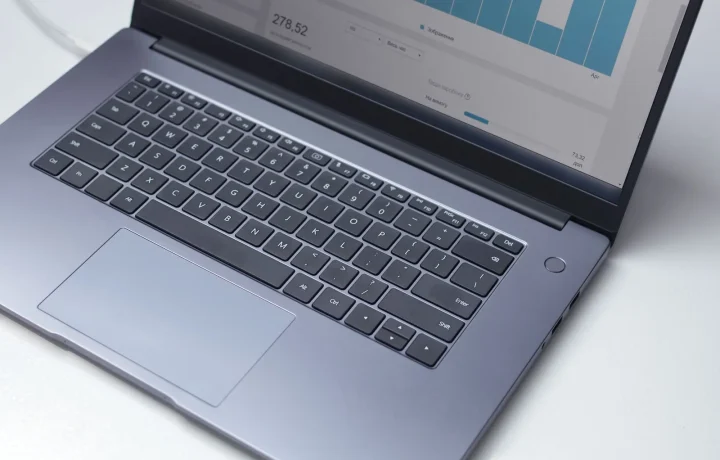 Overhead view of a laptop showing an analytics program, representing the core blog SEO basics